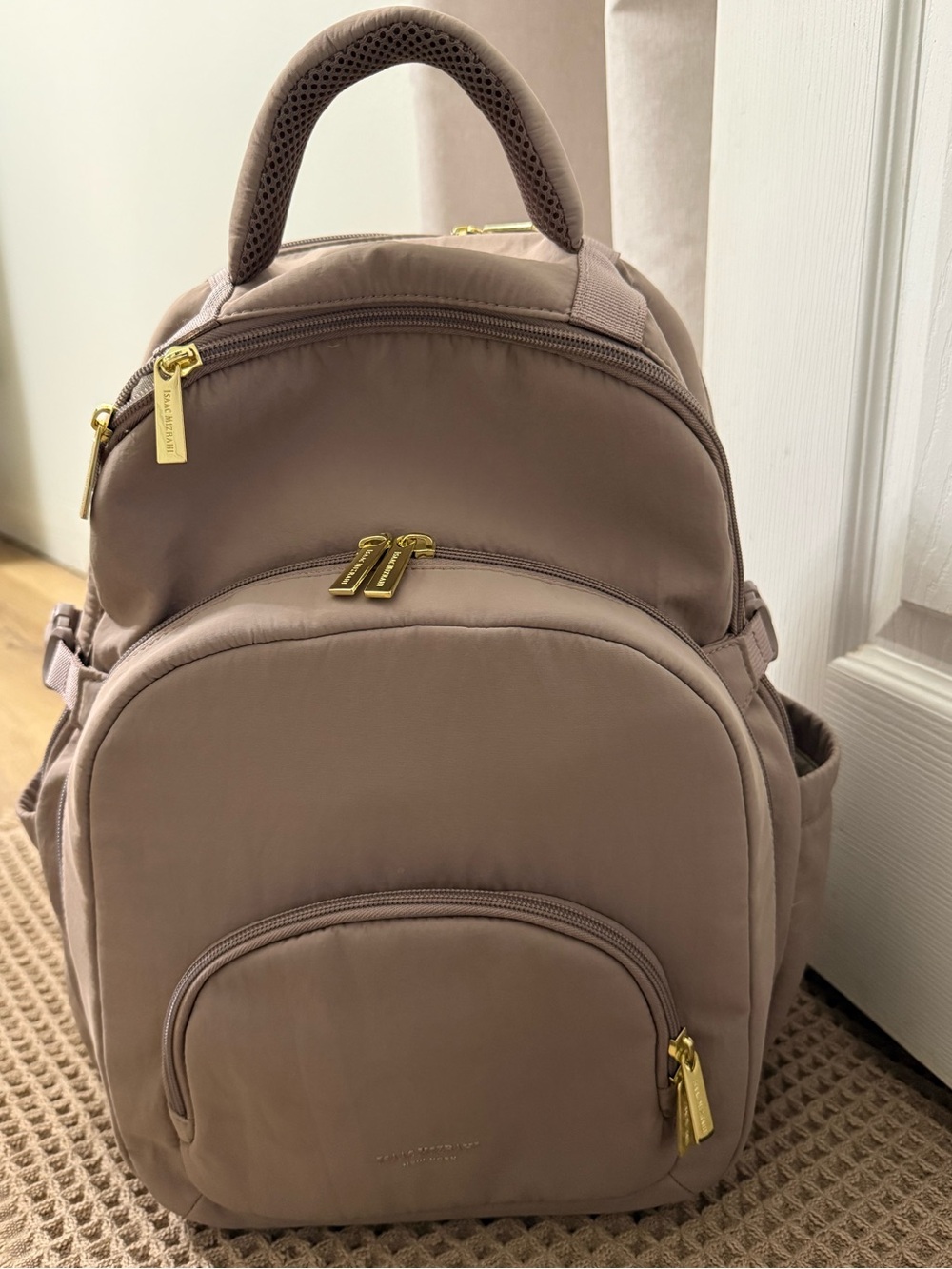 Isaac Mizrahi taupe colored backpack